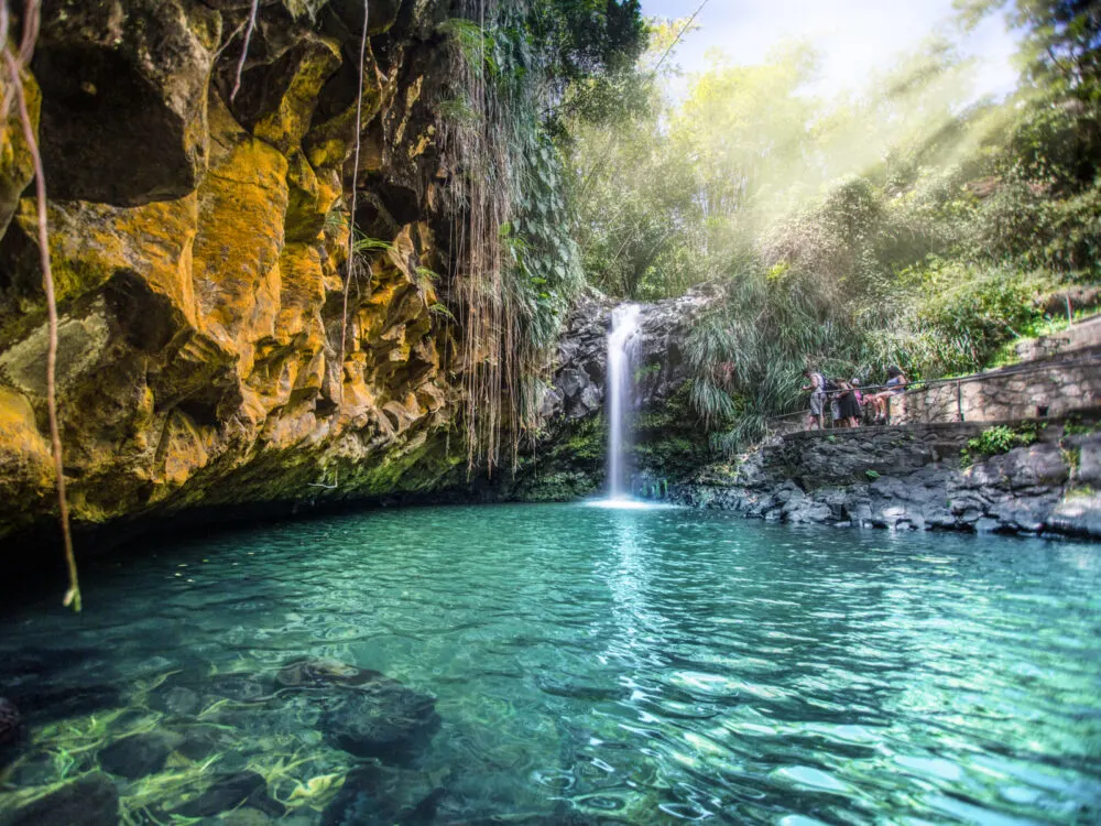 Annandale Falls with teal water and stunning rocks on one of our top picks for the best places to visit in the Caribbean, Grenada