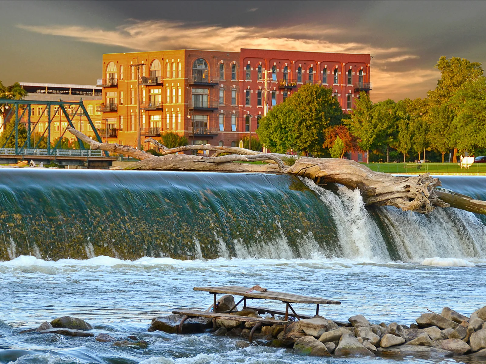 Driftwood log on top of a dam in one of the best places to visit in Michigan, Grand Rapids