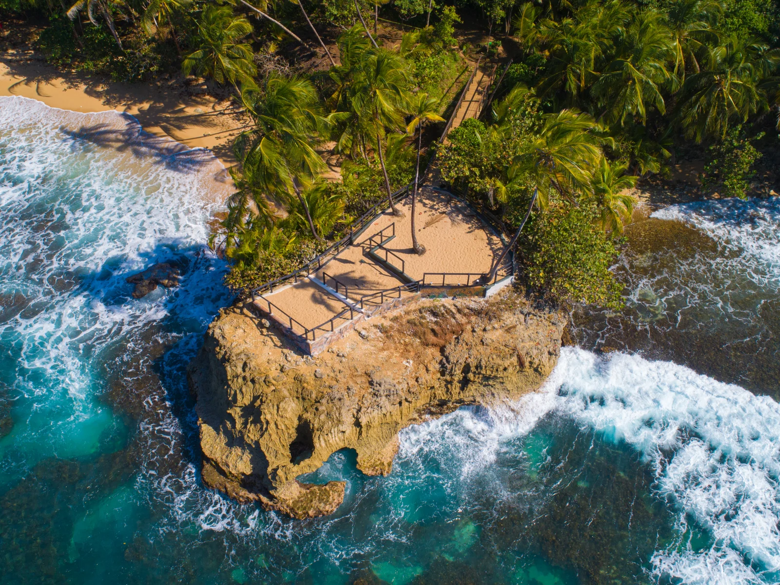 Elevated platform over waves in one of the best places to visit in Costa Rica, Puerto Viejo