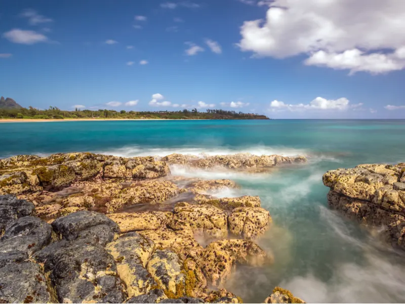 Low tide on a reef at Kealia beach in Kauai, one of the best beaches in Hawaii