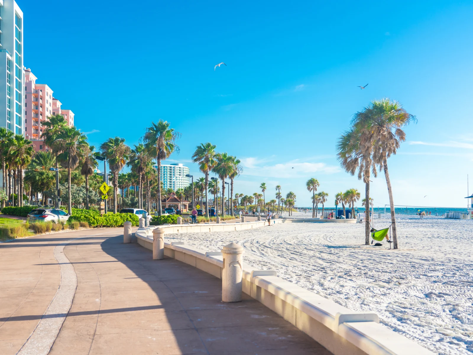 One of the best places to visit in Florida, Clearwater, as seen from the road next to the white sand beach