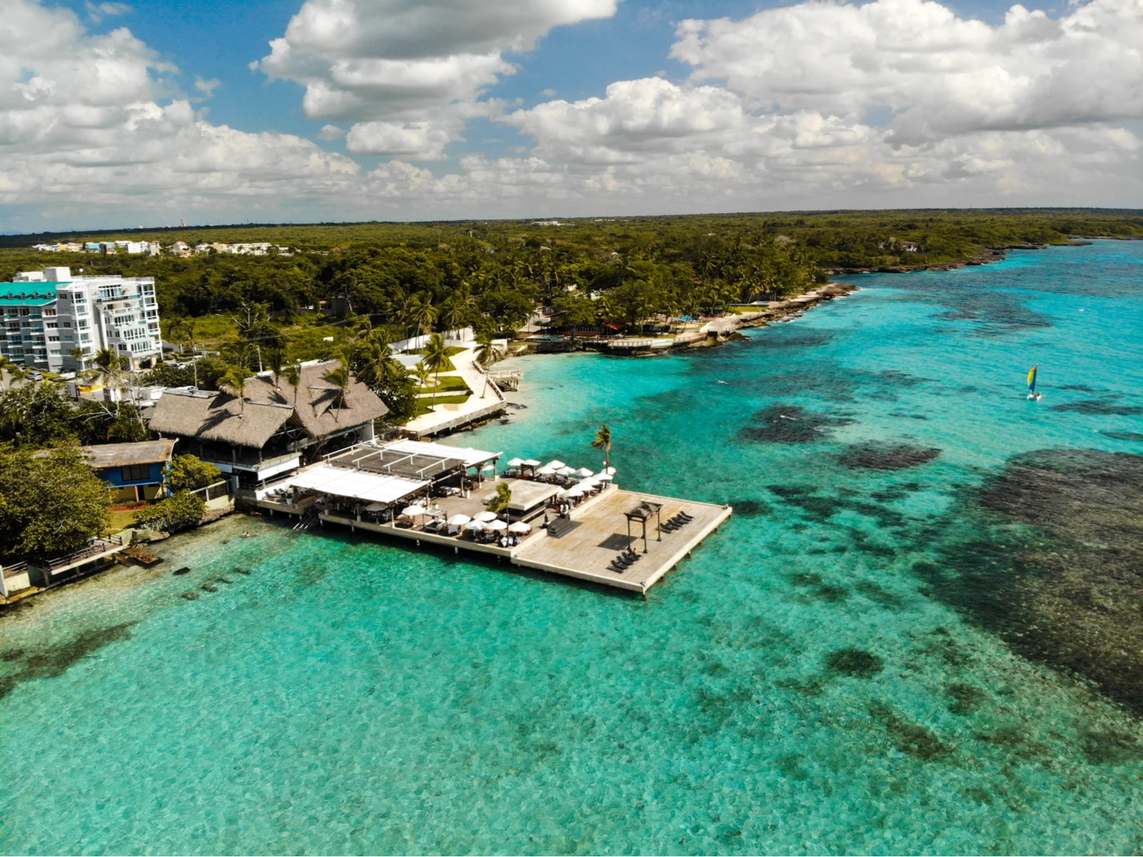 A restaurant built on a dock for better view of the beach as a piece on the best beaches in the Dominican Republic at Playa Boca Chica