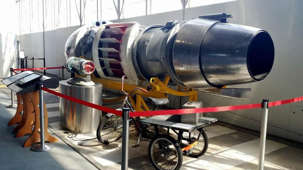 A gigantic old plane engine cordoned red in an exhibit at Delta Flight Museum, one of the best tourist attractions in Georgia