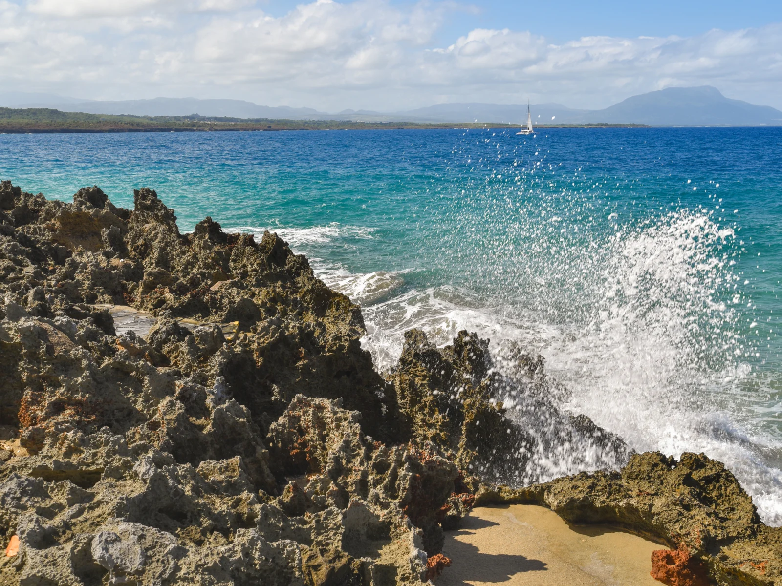 Caribbean surf breaking on the rocks in Sousa, one of the best places to visit in the Dominican Republic